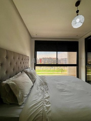 Locations de vacances à Agadir : Appartement élégant avec 3 chambres et piscine à l'Établissement Agadir Bay - 1 500 DH pour 5 personnes.