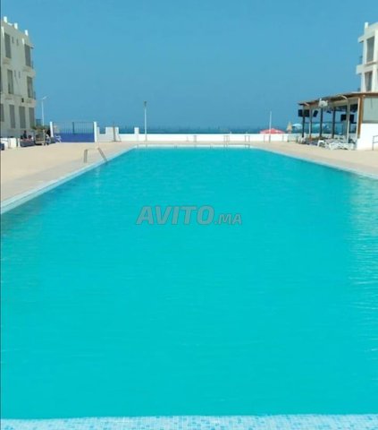 Locations de vacances à Agadir : Bel appartement avec piscine près de la mer à Aourir, Agadir - 3 600 DH pour 5+ personnes.